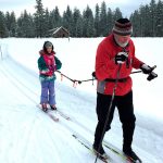 Dick Ewing, an instructor with the Methow Valley Ski School, tows Olivia &ldquo;Veeka&rdquo; Duin, 11, through a meadow near Goat Creek Trail. (Julia Duin / Washington Post)