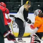 Lexi Bender runs through drills during the women&rsquo;s hockey clinic she co-hosted Friday afternoon at Xfinity Arena in Everett. (Kevin Clark / The Herald)