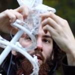 Baily Olson assembles decorations at Warm Beach Lights of Christmas on November 17. (Kevin Clark / The Herald)