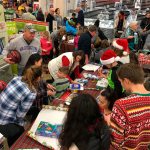 Cascade High School students help wrap presents at a South Everett-Mukilteo Rotary Club-sponsored event. (Contributed photo)