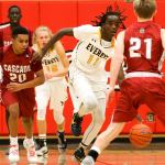 Everett&rsquo;s Louis Davis starts a run with Cascade&rsquo;s Nicholas Klemp, (21) defending during the annual Battle of Broadway Friday night at Everett Community College on December 2, 2016. (Kevin Clark / The Herald)