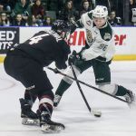 The Silvertips&rsquo; Dominic Zwerger attempts a shot with the Giants&rsquo; Bailey Dhaliwal defending in the second period Wednesday night at Xfinity Arena in Everett. (Kevin Clark / The Herald)