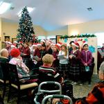 The children of grades 3-5 at St. Michael Catholic School brought some Christmas cheer to residents of Pacifica Senior Living in Snohomish. (Contributed photo)