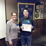 Cassie Franklin, South Everett-Mukilteo Rotary Club president, congratulates Kamiak High School senior Michael Li as one of the club&rsquo;s Students of the Month for November. (Contributed photo)