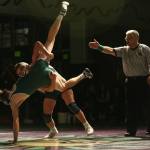 Everett&rsquo;s Brett Allred takes down Edmonds-Woodway&rsquo;s Anthony Lindamood during a match Thursday night at Edmonds-Woodway High School. (Kevin Clark / The Herald)
