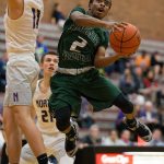 Edmonds-Woodway&rsquo;s Jalen Nash leaps around a North Kitsap defender for a shot at the basket as Edmonds-Woodway lost to North Kitsap 68-62 at the 2016 Mountlake Terrace Boys Varsity Basketball Tournament on Tuesday, Dec. 27, 2016 in Mountlake Terrace, Wa. (Andy Bronson / The Herald)