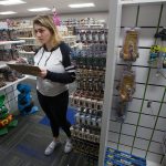 Georgia Paschen takes inventory in the samples room at Funko, a pop culture and licensed-focused collectibles company. (Andy Bronson / The Herald)