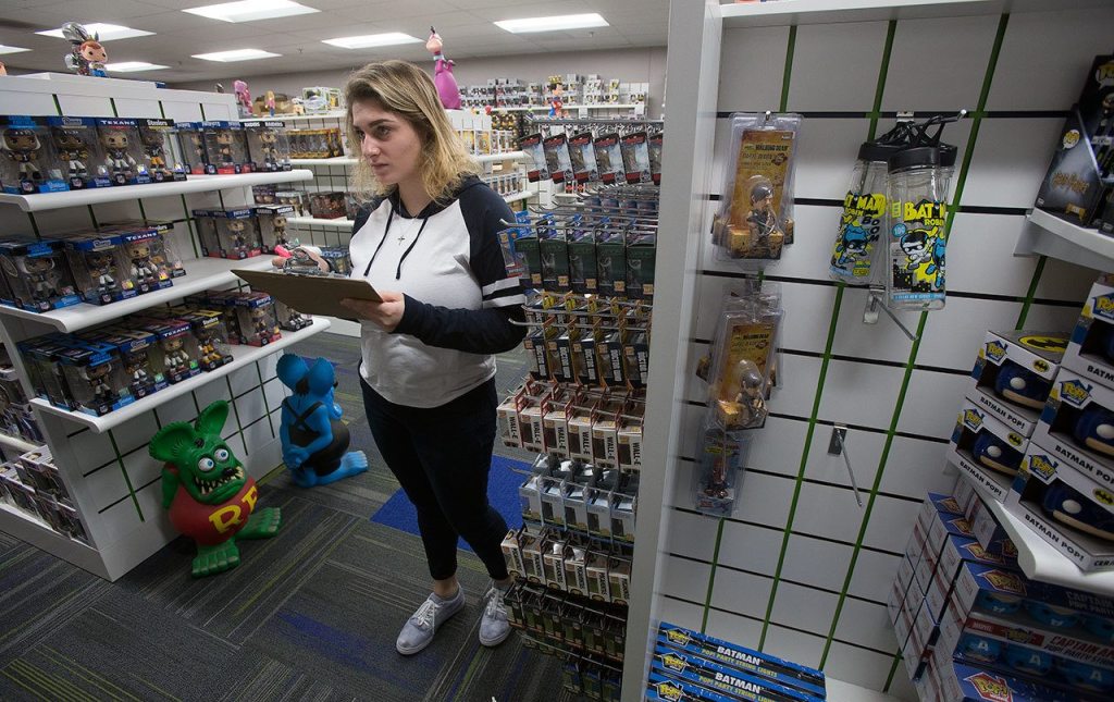 Georgia Paschen takes inventory in the samples room at Funko, a pop culture and licensed-focused collectibles company. (Andy Bronson / The Herald)
