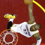 In this May 17, 2016 photo, Cleveland Cavaliers&rsquo; LeBron James dunks against the Toronto Raptors during the first half of Game 1 of the NBA basketball Eastern Conference finals, in Cleveland. On Tuesday, Dec. 27, James, who ended 52 years of sports heartache by bringing Cleveland a championship and used his superstar platform to address social causes, was chosen as The Associated Press 2016 Male Athlete of the Year. (AP Photo/Tony Dejak, File)