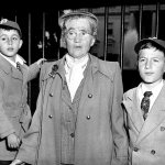 In this June 14, 1953 photo, Sophie Rosenberg is shown with her grandsons Robert, 6, left, and Michael, 10, outside the White House in Washington, D.C., during a demonstration seeking clemency for her son Julius and daughter-in-law Ethel Rosenberg. The sons of convicted spy Ethel Rosenberg are asking President Barack Obama to exonerate their mother. (AP Photo)