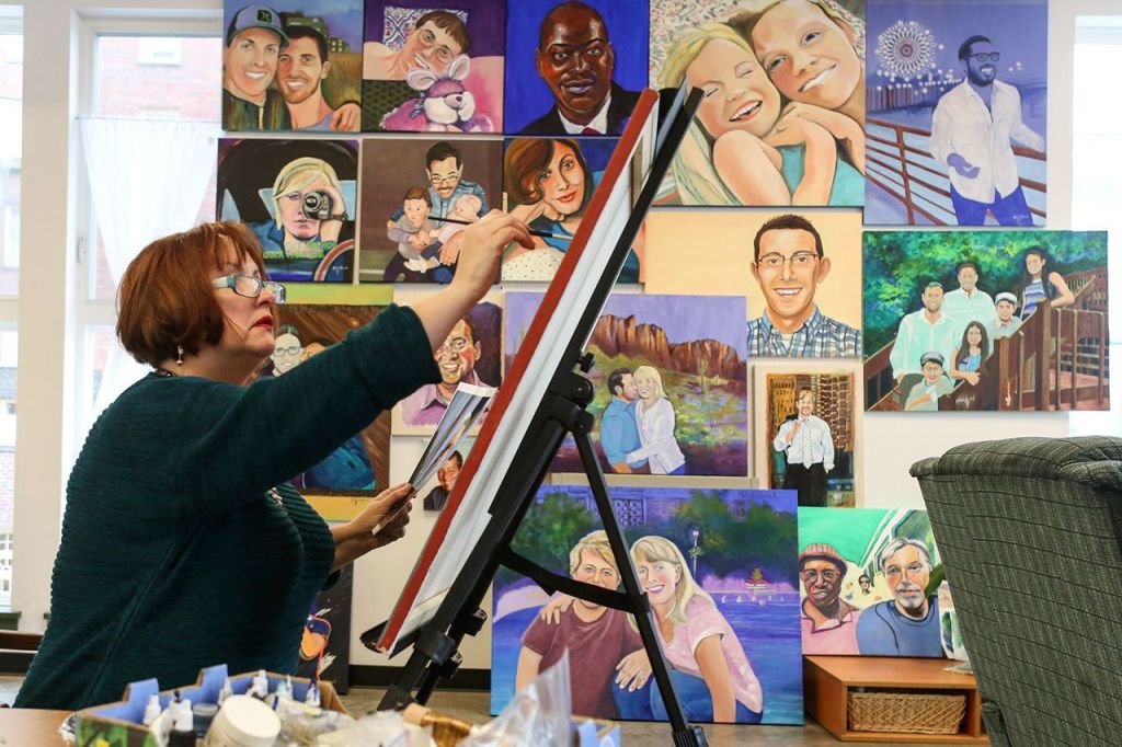 Melinda Hannah, local artist, works on one of her pieces that will be showing her portraits of LGBT Mormons at the Schack on December 18, 2016. (Kevin Clark / The Herald)