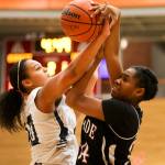 Everett&rsquo;s Alexis Rutter, left, and Cascade&rsquo;s Kharial Clark get tangled for control of a loose ball during the annual Battle of Broadway Friday night at Everett Community College on December 2, 2016. (Kevin Clark / The Herald)                                Everett&rsquo;s Alexis Rutter, left, and Cascade&rsquo;s Kharial Clark get tangled for control of a loose ball during the annual Battle of Broadway Friday night at Everett Community College on December 2, 2016. (Kevin Clark / The Herald)