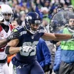 Seahawks wide receiver Doug Baldwin extends for extra yardage Cardinals corner back Patrick Peterson trailing Saturday afternoon at CenturyLink Field in Seattle on December 24, 2016. The Cardinals won 34-31. (Kevin Clark / The Herald)