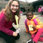 Izabel Negron (right) is helped by Shoelace Brigade member Makenzie Powers at Penny Creek Elementary School. (Contributed photo)