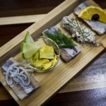 A Herrings Bord, consisting of five different pickled herring bites, is seen at Old Ballard Liquor Co. (Ian Terry / The Herald)