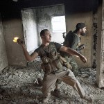 Free Syrian Army soldiers throws a petrol bomb against Syrian Army positions in Saif Al Dawle district in Aleppo, Syria, on Oct. 3, 2012. (AP Photo /Manu Brabo, File)