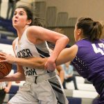 Lake Stevens&rsquo; Rocky Leenstra (right) reaches in to knock the ball loose from Glacier Peak&rsquo;s Samantha Fatkin on Wednesday night at Glacier Peak High School in Snohomish. (Kevin Clark / The Herald)