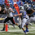 Archbishop Murphy&rsquo;s Collin Montez crosses the goal line for a touchdown with Liberty&rsquo;s Juan Flores (35) and Julian Bruce trailing during the 2A state championship game on Saturday at the Tacoma Dome. Archbishop Murphy defeated Liberty 56-14. (Kevin Clark / The Herald)