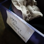 A bin full of winter clothing sits in a clothing closet at Cocoon House&rsquo;s U-Turn drop-in center on Broadway in Everett on Tuesday, Dec. 13. (Ian Terry / The Herald)