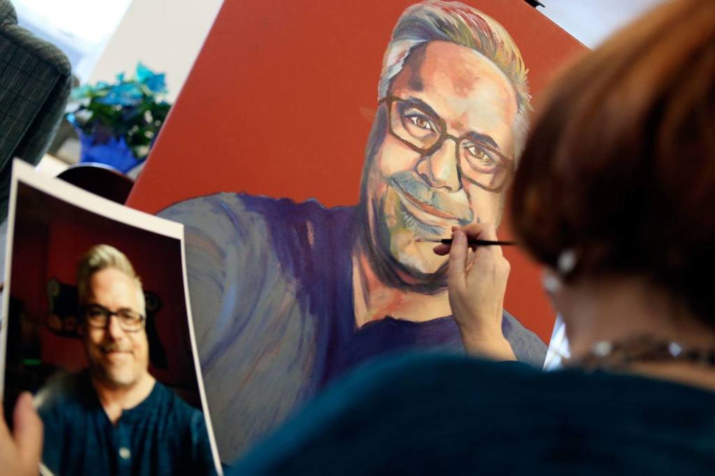 Melinda Hannah, local artist, works on one of her pieces that will be showing her portraits of LGBT Mormons at the Schack on December 18, 2016. (Kevin Clark / The Herald)