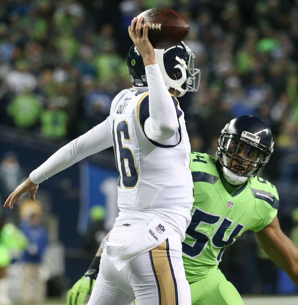 Rams quarterback Jared Goff winds up to pass with Seahawks linebacker Bobby Wagner closing at CenturyLink Field Thursday night in Seattle on December 15, 2016. (Kevin Clark / The Herald)