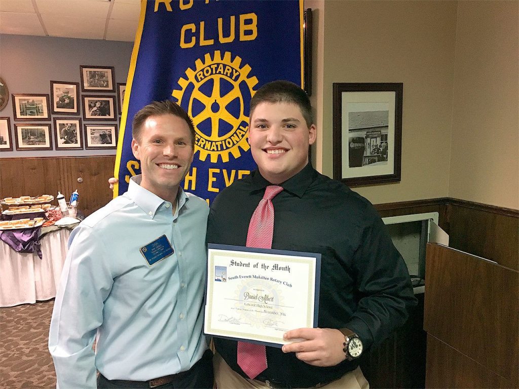 South Everett-Mukilteo Rotary president nominee Dan Leach congratulates Cascade High School senior Daniel Albert on being named one of the club&rsquo;s Students of the Month for November. (Contributed photo)