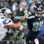 Seahawks tight end Jimmy Graham stiff arms Panthers linebacker A.J. Klein Sunday night at CenturyLink Field in Seattle on December 4, 2016.(Kevin Clark / The Herald)