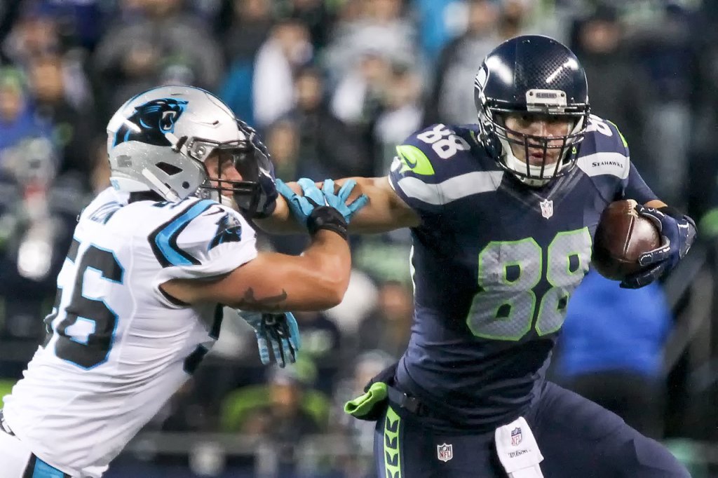 Seahawks tight end Jimmy Graham stiff arms Panthers linebacker A.J. Klein Sunday night at CenturyLink Field in Seattle on December 4, 2016.(Kevin Clark / The Herald)