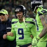 Seahawks punter Jon Ryan is helped off the field after a 50 yard run at CenturyLink Field Thursday night in Seattle on December 15, 2016. (Kevin Clark / The Herald)