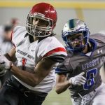 Archbishop Murphy&rsquo;s Kyler Gordon races for the end zone and a touchdown with Liberty&rsquo;s Dulin Hayden trailing during the 2A state championship game on Saturday at the Tacoma Dome. Archbishop Murphy defeated Liberty 56-14. (Kevin Clark / The Herald)