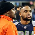 Former Seahawks running back Marshawn Lynch, left, talks with current Seahawks running back Thomas Rawls during the game against the Panthers Sunday night at CenturyLink Field in Seattle on December 4, 2016.(Kevin Clark / The Herald)