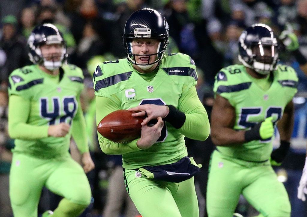 Seahawks punter Jon Ryan bobbles the ball at CenturyLink Field Thursday night in Seattle on December 15, 2016. (Kevin Clark / The Herald)