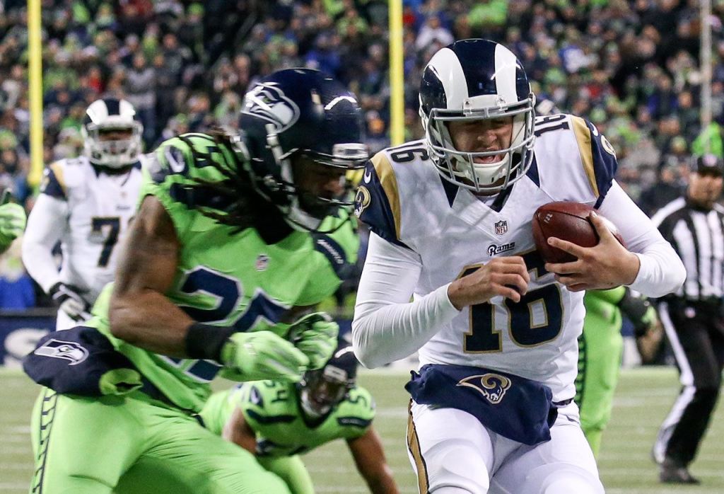 Seahawks corner back Richard Sherman knocks Rams quarterback Jared Goff out of bounds just shy of the endzone at CenturyLink Field Thursday night in Seattle on December 15, 2016. (Kevin Clark / The Herald)