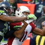 Cardinals wide receiver Larry Fitzgerald makes a reception with Seahawks player DeShawn Shead defending Saturday afternoon at CenturyLink Field in Seattle on December 24, 2016. The Cardinals won 34-31. (Kevin Clark / The Herald)