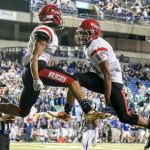 Archbishop Murphy&rsquo;s Kyler Gordon (left) and Anfernee Gurley celebrate a touchdown during the 2A state championship game against Liberty on Saturday at the Tacoma Dome. Archbishop Murphy defeated Liberty 56-14. (Kevin Clark / The Herald)