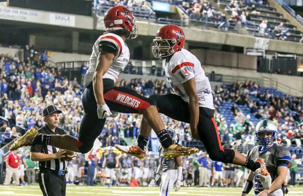 Archbishop Murphy&rsquo;s Kyler Gordon (left) and Anfernee Gurley celebrate a touchdown during the 2A state championship game against Liberty on Saturday at the Tacoma Dome. Archbishop Murphy defeated Liberty 56-14. (Kevin Clark / The Herald)