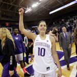 Washington guard Kelsey Plum (10) gives a fist pump to the crowd following the Huskies&rsquo; 92-66 win over Boise State on Sunday. Plum became the Pac-12&rsquo;s career scoring leader during the game, moving her past former Stanford star Chiney Ogwumike. (AP Photo/Elaine Thompson)