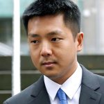 Jonathan Ly leaves U.S. District Court in Seattle after pleading guilty to one count of securities fraud on Monday, Dec. 5. Ly pleaded guilty to allegations that he used his access to the computers of top executives to rummage through their email, then made lucrative illegal stock trades based on the inside information he discovered. (AP Photo/Elaine Thompson)