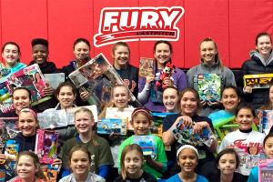 Fastpitch teams collect toys for kids
