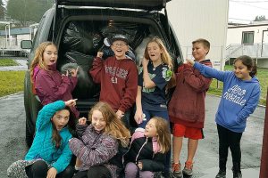 Students help Elks collect toys, books for Christmas House