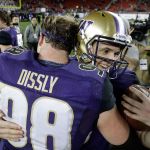 Washington quarterback Jake Browning (right) is hugged by tight end Will Dissly (98) after the team&rsquo;s 41-10 win over Colorado in the Pac-12 Conference championship game Friday in Santa Clara, California. (AP Photo/Marcio Jose Sanchez)