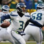 Seattle Seahawks quarterback Russell Wilson drops back during the first half of Sunday&rsquo;s game against the Green Bay Packers. Wilson threw a career-high five interceptions in the game. (AP Photo/Mike Roemer)