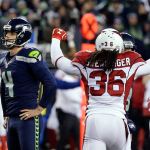 Seahawks kicker Steven Hauschka, left, and Arizona Cardinals free safety D.J. Swearinger (36) react after Hauschka missed a point after a touchdown in the fourth quarter of Saturday&rsquo;s game in Seattle. (AP Photo/Ted S. Warren)