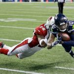 Seahawks wide receiver Paul Richardson (10) is tackled by Arizona Cardinals cornerback Brandon Williams, left, after a reception in the second half of a Saturday&rsquo;s game in Seattle. (AP Photo/Ted S. Warren)