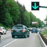 Drivers will be able to use the right-hand shoulder on northbound I-405 between Highway 527 and I-5 when congestion is at its heaviest. Signs like the one depicted in this photo illustration will tell drivers when the shoulder is open. Crews started work on the $7 million project this month. (WSDOT illustration)