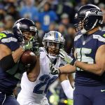Seahawks wide receiver Doug Baldwin makes a catch for a touchdown as Lions strong safety Don Carey and Seahawks wide receiver Jermaine Kearse look on in the second half of Saturday&rsquo;s game. (AP Photo/Elaine Thompson)