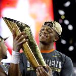 Clemson&rsquo;s Deshaun Watson holds up the championship trophy Monday after the Tigers beat Alabama 35-31 in Tampa, Fla. (AP Photo/David J. Phillip)
