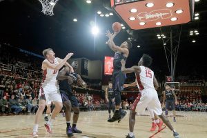 Flat 1st half costs Washington men in 76-69 loss at Stanford