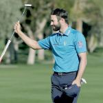 Adam Hadwin celebrates on the 18th hole after shooting a 59 to take the lead after the third round of the CareerBuilder Challenge at La Quinta Country Club on Saturday in La Quinta, Calif. (AP Photo/Chris Carlson)