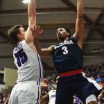 Gonzaga forward Johnathan Williams puts up a shot over Portland center Philipp Hartwich during the second half of Monday&rsquo;s game. (AP Photo/Steve Dykes)